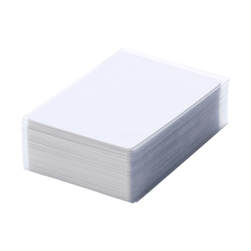 A stack of blank, white card sleeves neatly arranged, ready for protecting trading cards.